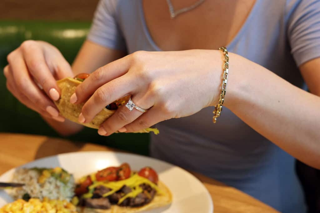 Princess cut diamond in a side stone ring