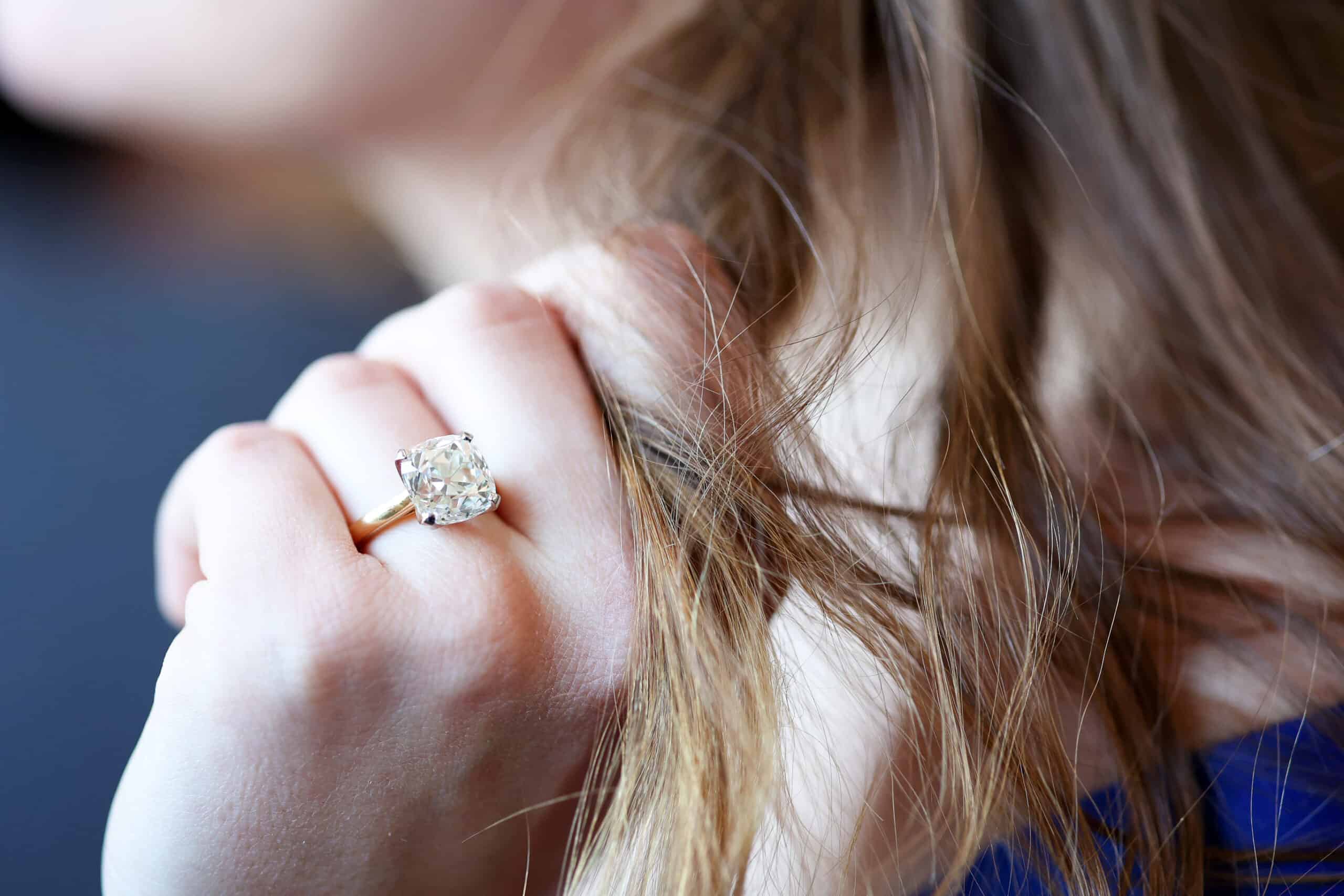 Detail of an Old miner cut in yellow gold solitaire setting