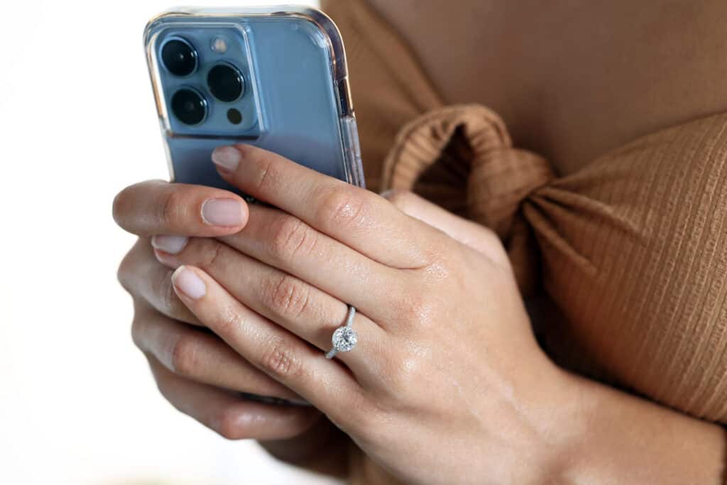 $25k diamond engagement ring on a woman's hand