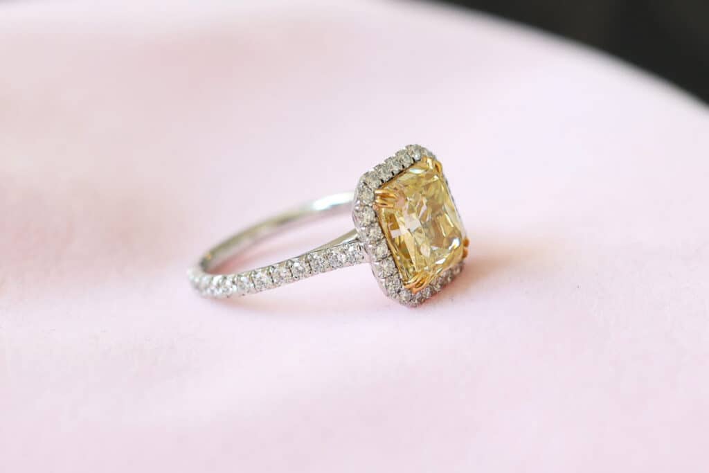 Fancy Yellow Radiant Cut Diamond in a halo setting 