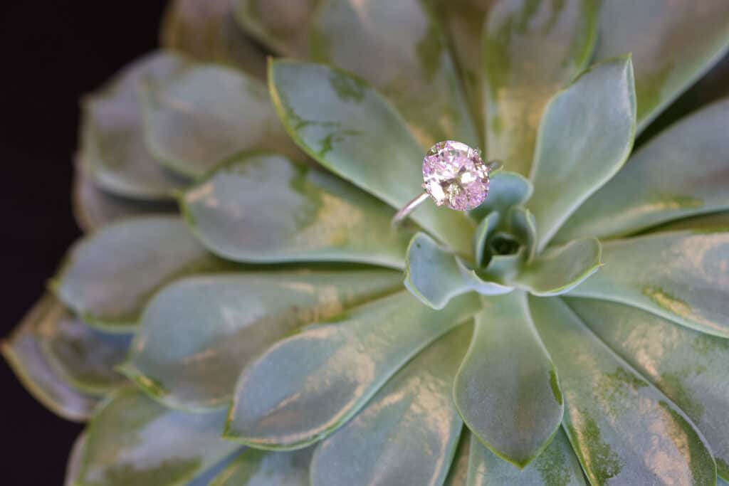 A Fancy Light Pink Oval Cut Diamond in a simple setting