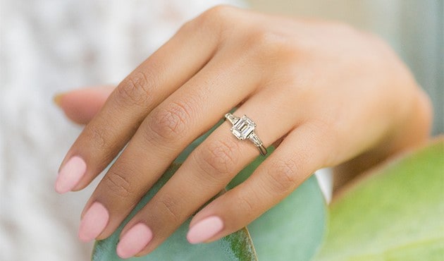 Tapered Baguette Diamond Engagement Ring with an emerald cut diamond center