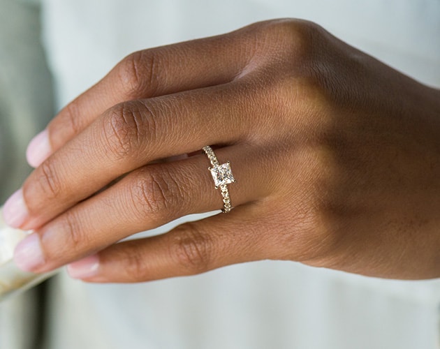 french pave setting with a princess cut diamond