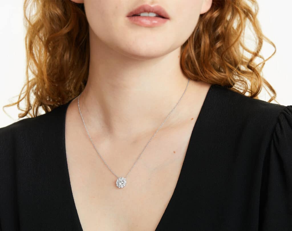 A halo pendant on a woman's neck