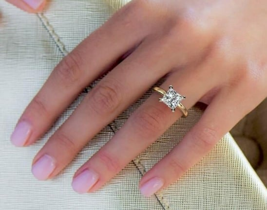 A 2.50ct princess cut diamond on a woman's hand