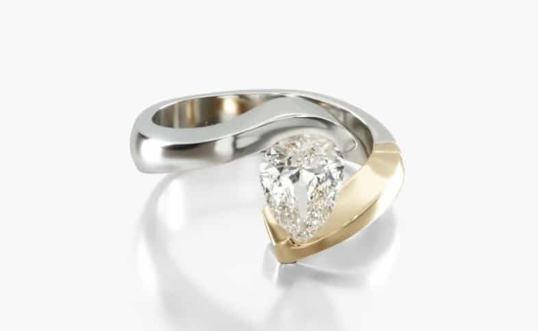 Tension settign for a pear shape diamond with two tones of gold