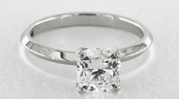Solitaire setting with a cushion diamond