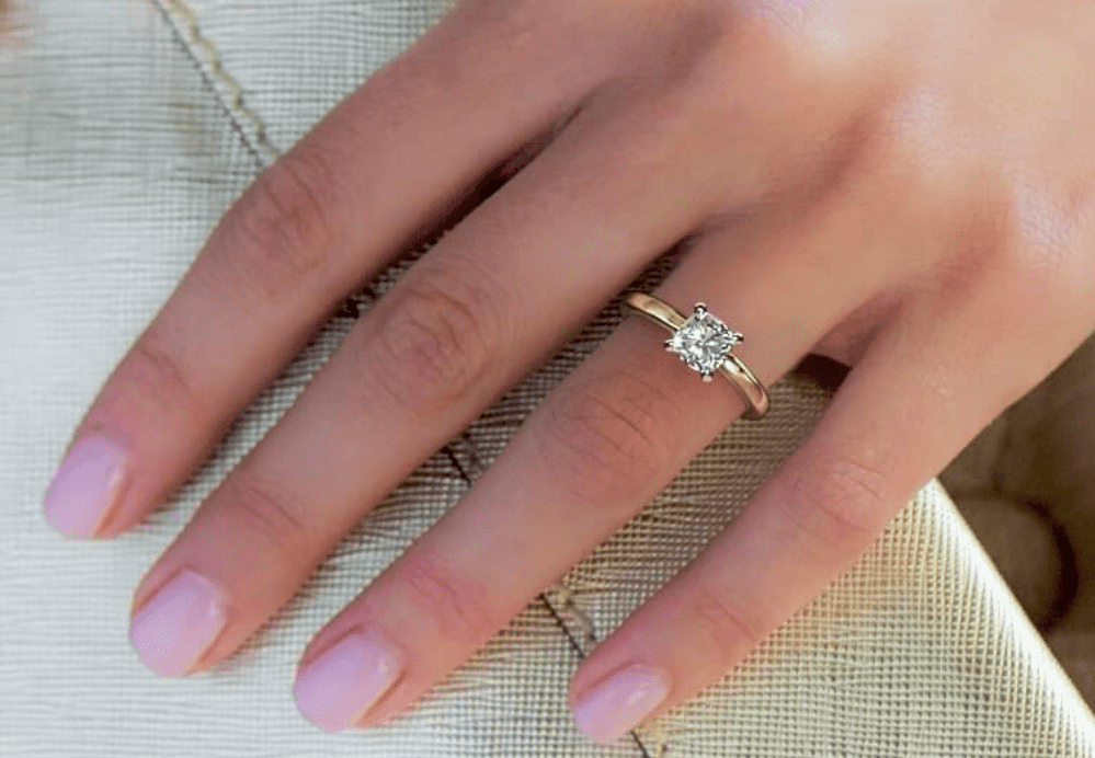 1ct cushion cut diamond on a finger