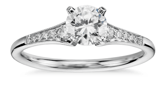 Round cut milgrain side stone engagement ring